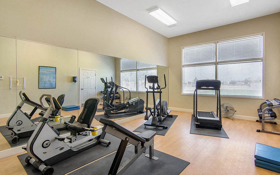 a gym with weights and other exercise equipment