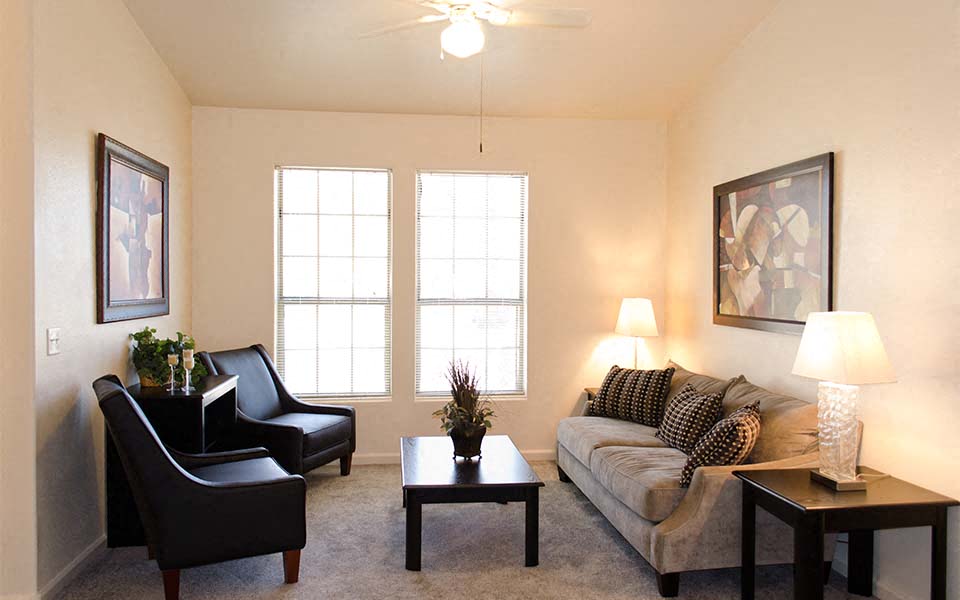 a living room with a couch and a table