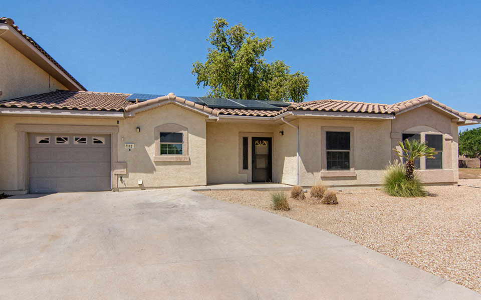 a house with a driveway and a garage door