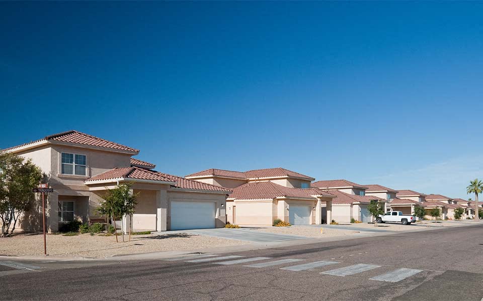 a row of houses on the side of a street