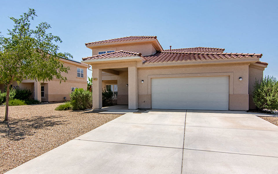 a house with a garage door and a driveway