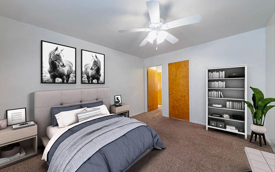 a bedroom with a bed and a ceiling fan