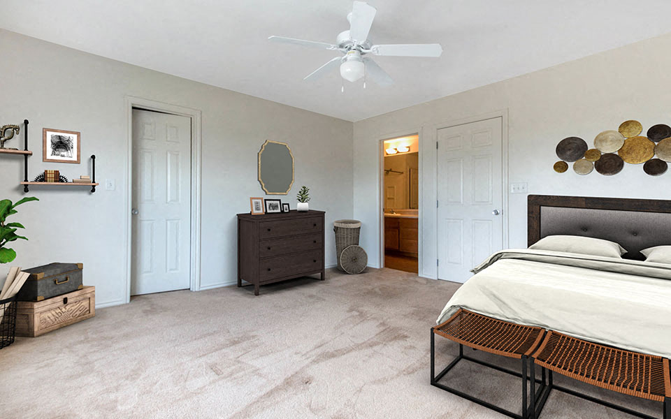 a bedroom with a bed and a ceiling fan