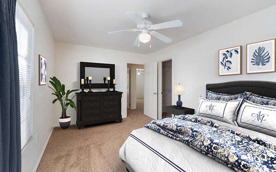 a bedroom with a bed and a ceiling fan