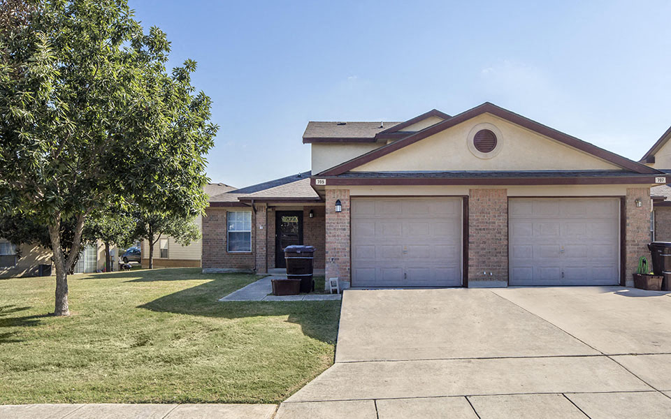a house with a driveway and a garage door