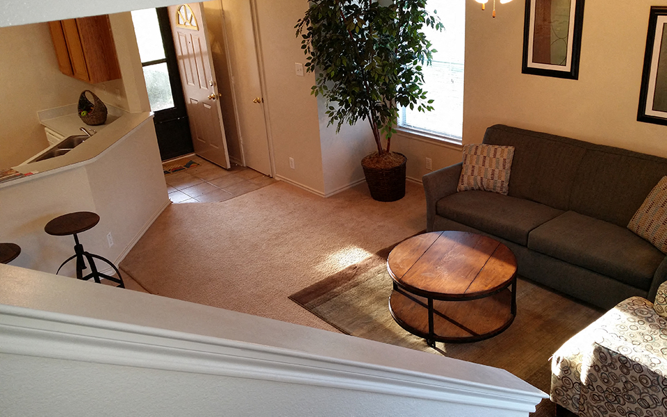 a living room with a couch and a table