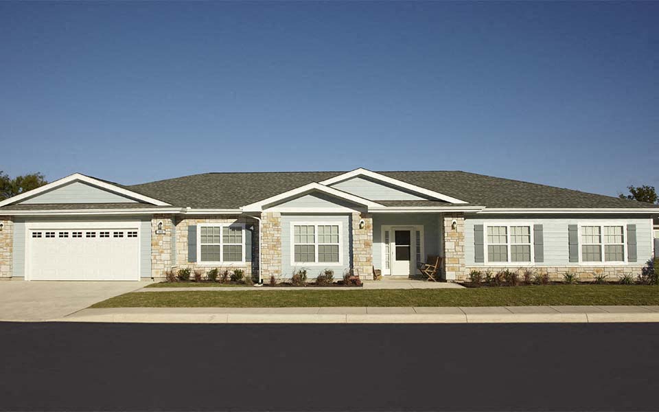 a brick house with a white garage door