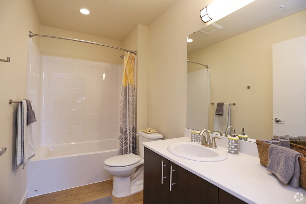 a bathroom with a sink toilet and a shower