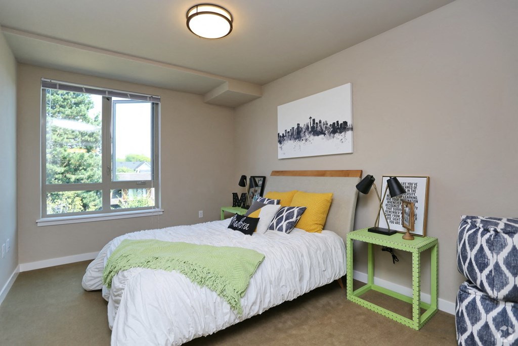 a bedroom with a bed and a green table