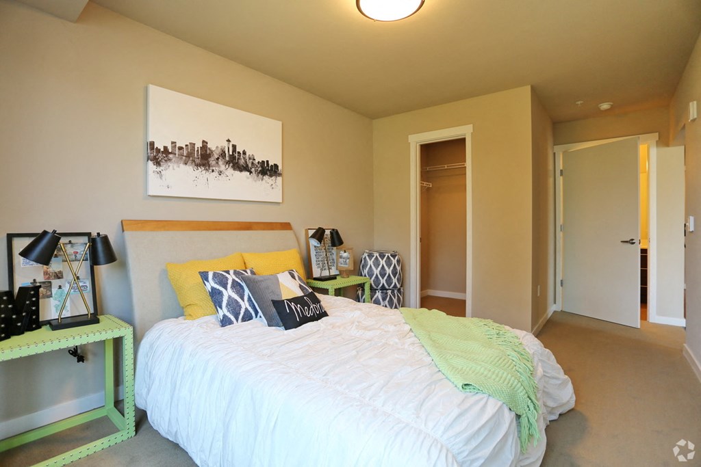 a bedroom with a bed and a closet