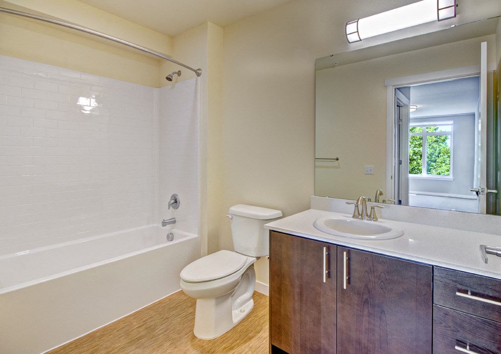 a bathroom with a sink toilet and a bath tub