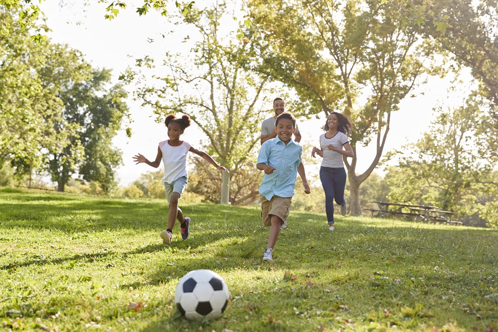 family-playing-soccer-in-park at Fairmont  Apartments, Washington