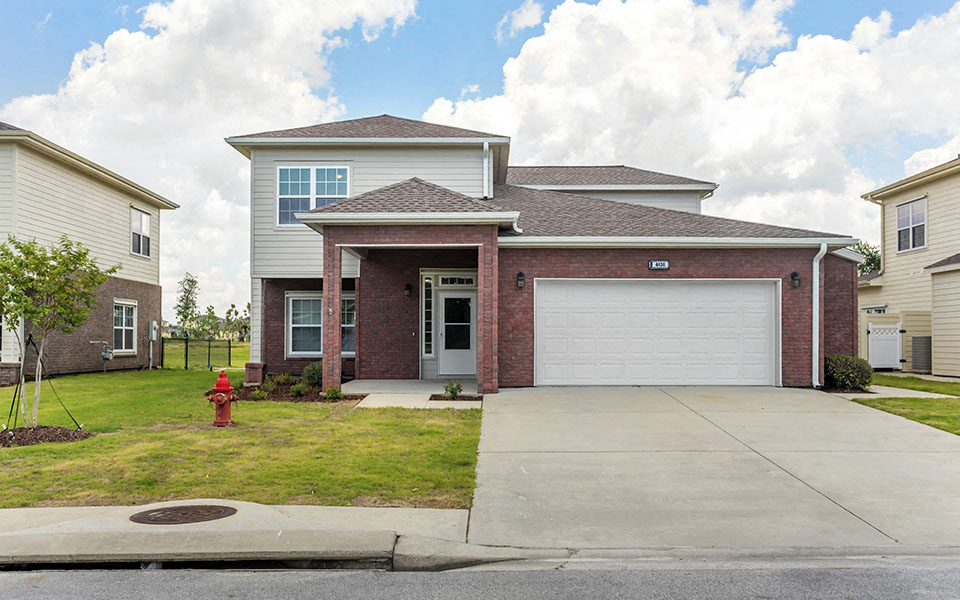 a house with a driveway and a garage door