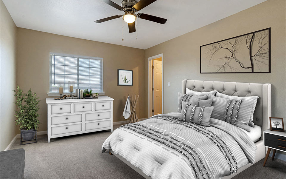a bedroom with a bed and a ceiling fan