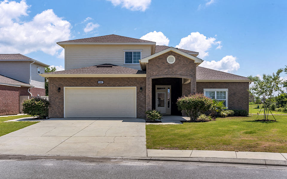 a house with a driveway and a garage door