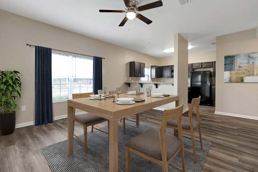 a dining room with a table and chairs