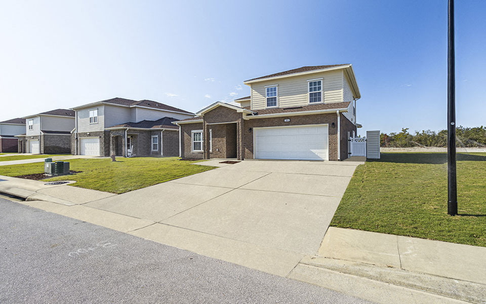 a house with a driveway and a garage door