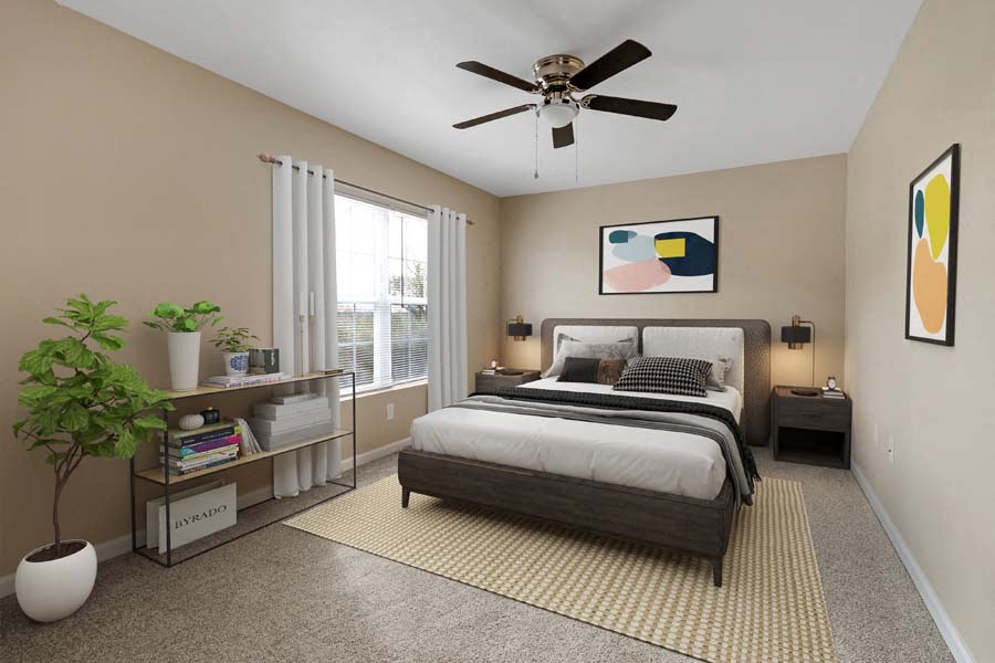 a bedroom with a bed and a ceiling fan