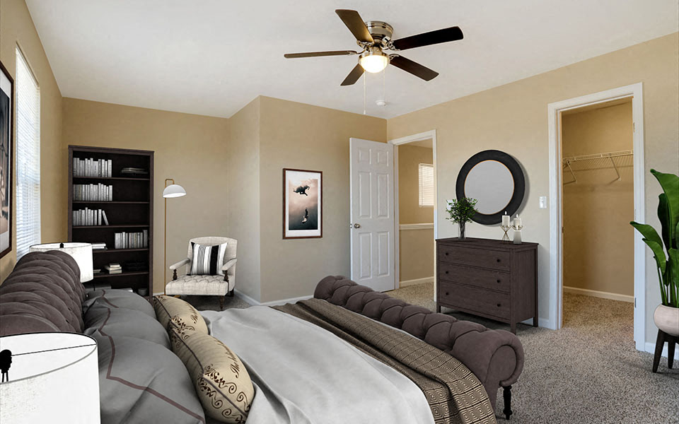 a bedroom with a bed and a ceiling fan