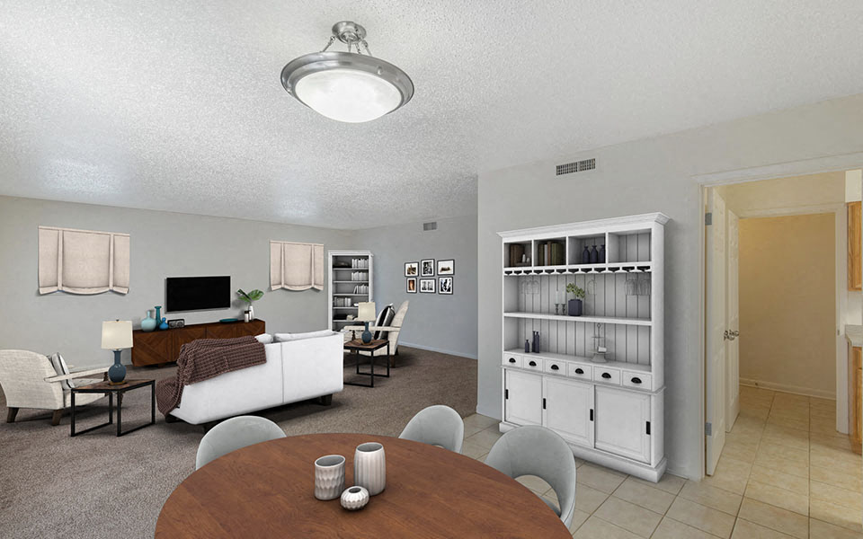 a dining room and living room with a couch and a table