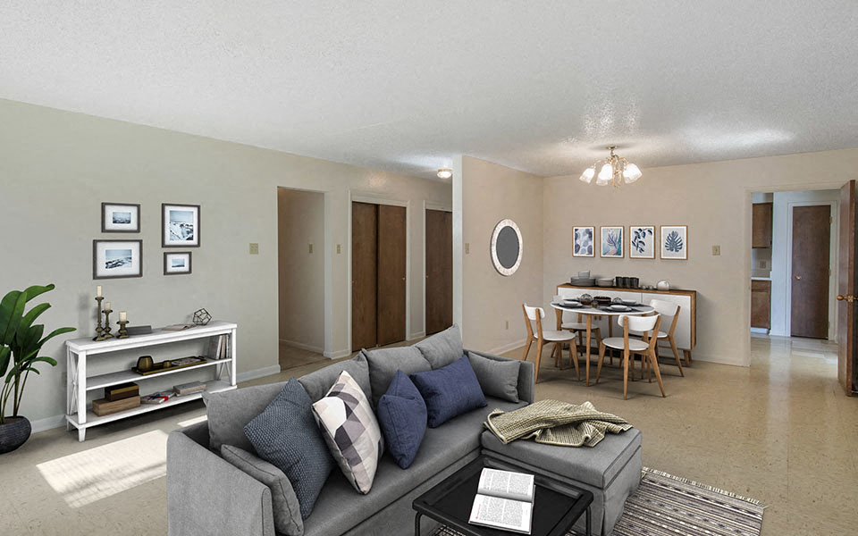 a living room and dining room with a couch and a table