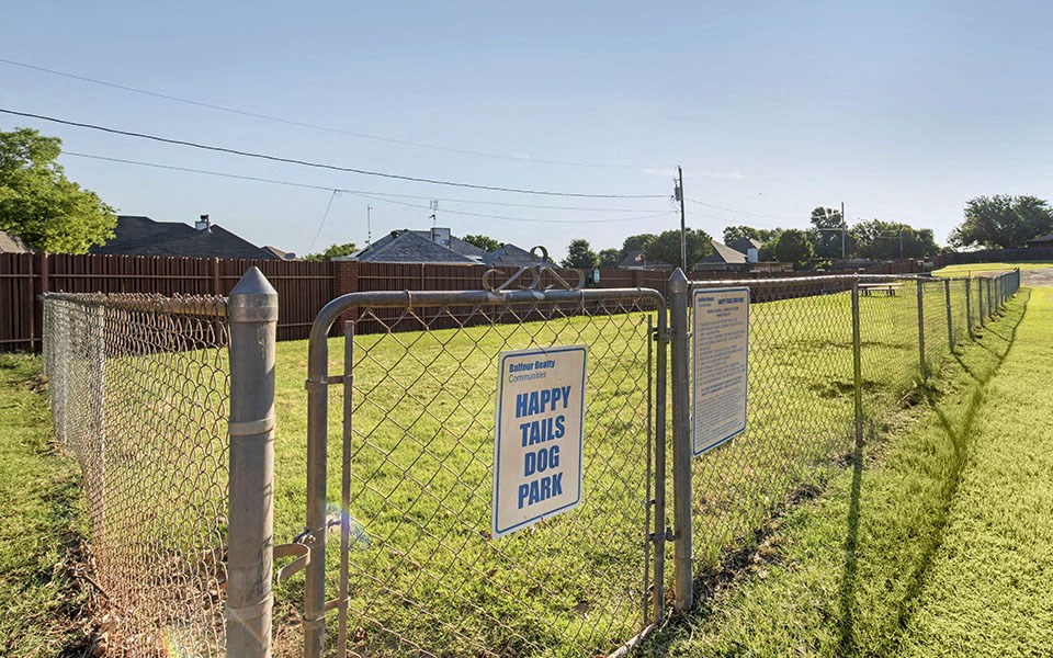 a fence with a sign that this is our park