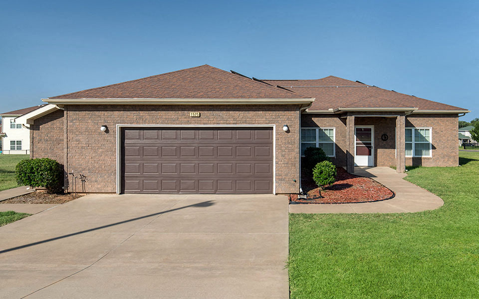 a house with a driveway and a garage door