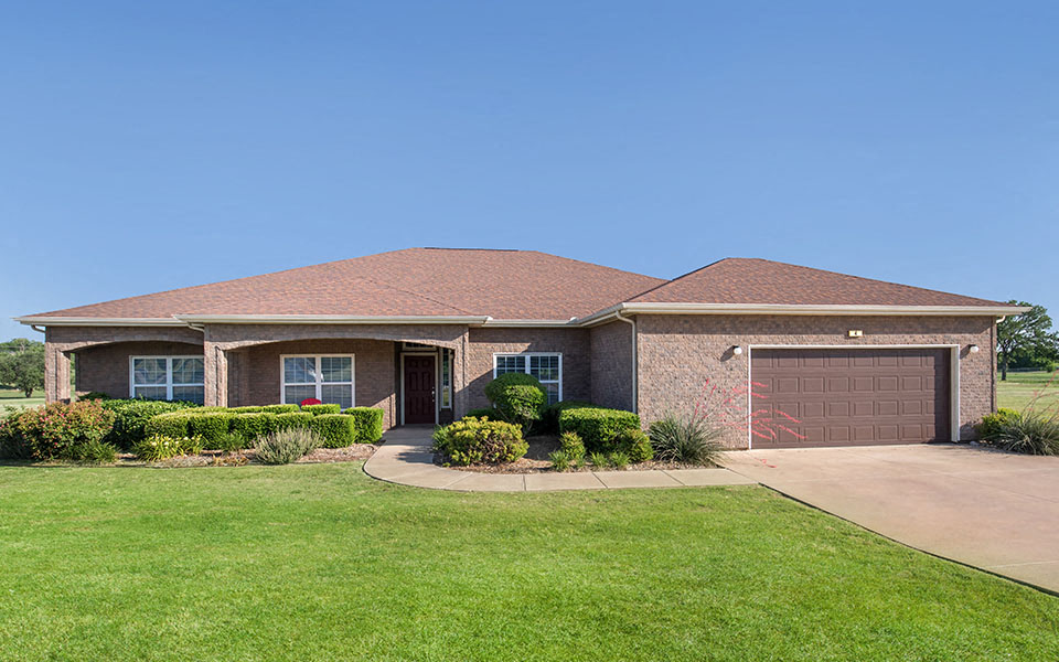 a house with a driveway and a garage door