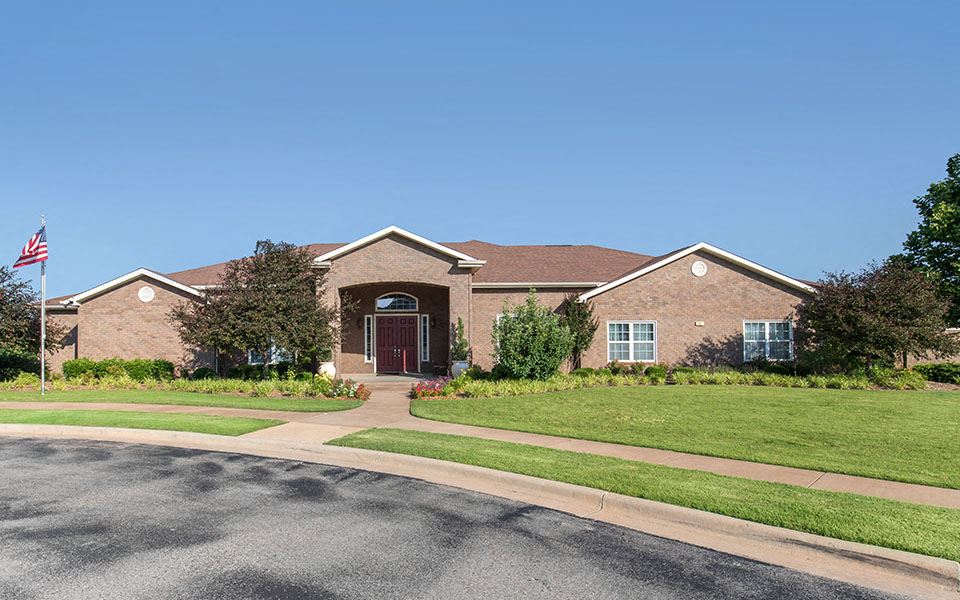 a brick house with an flag in front of it
