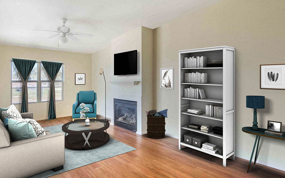 a living room with a couch and a book shelf and a fireplace