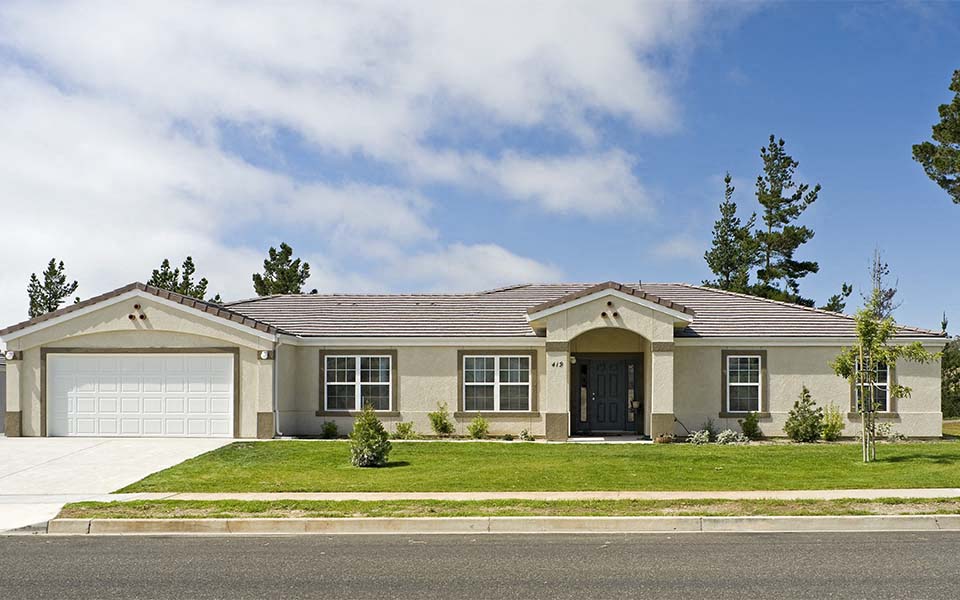 a house with a lawn and a garage