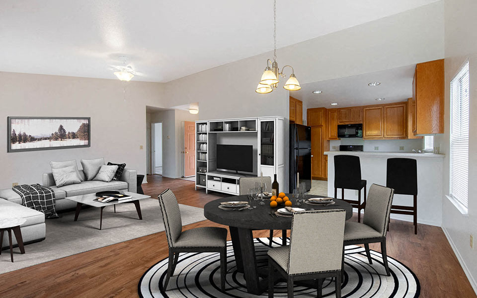 a living room and kitchen with a table and chairs