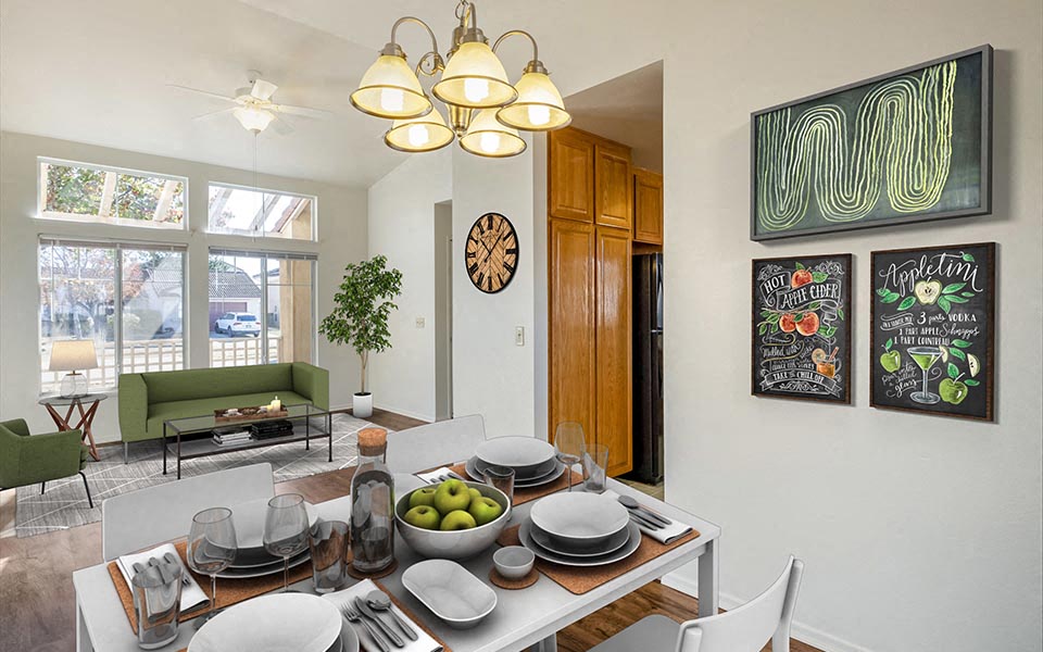 a dining room and living room with a table and chairs
