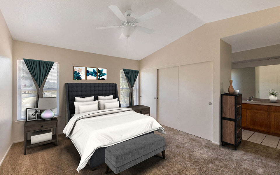 a bedroom with a bed and a ceiling fan