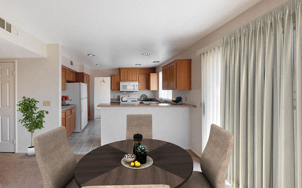 a kitchen and dining room with a table and chairs