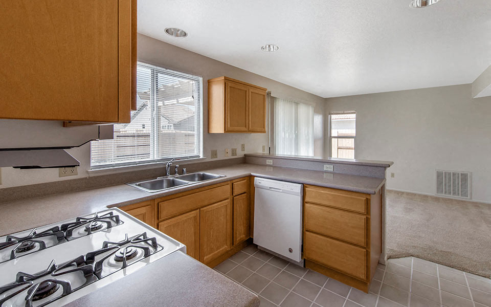 a kitchen with a stove and a sink