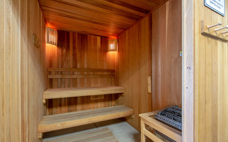 a wooden sauna in a room with benches