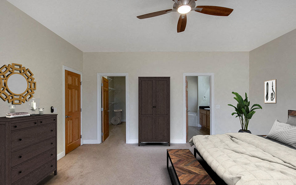 a bedroom with a bed and a ceiling fan