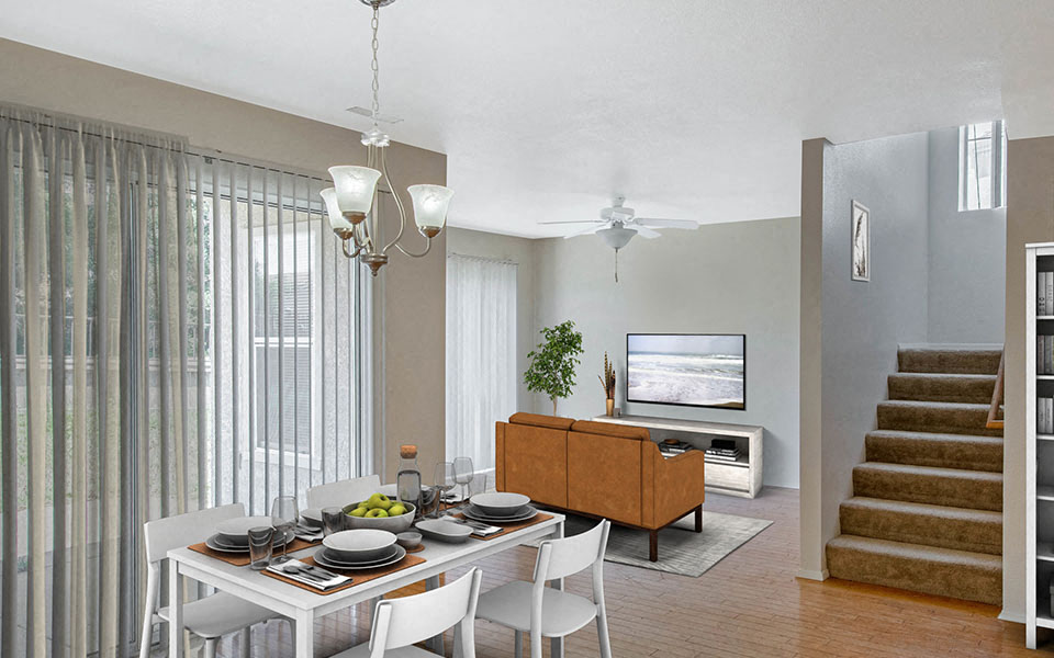 a dining room and living room with a table and chairs