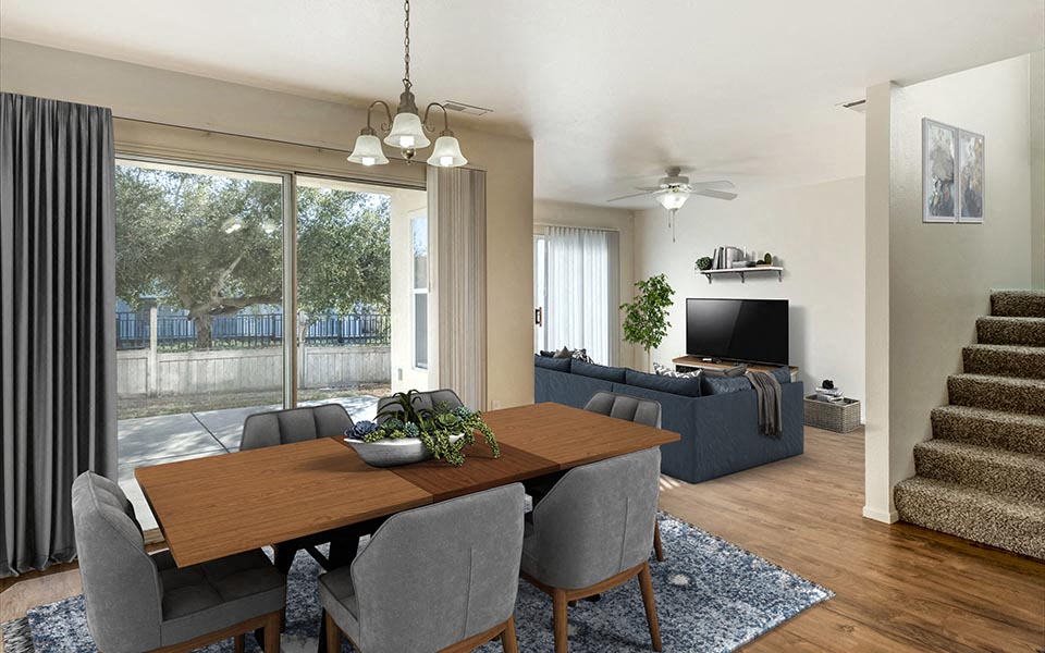 a living room and dining room with a table and chairs