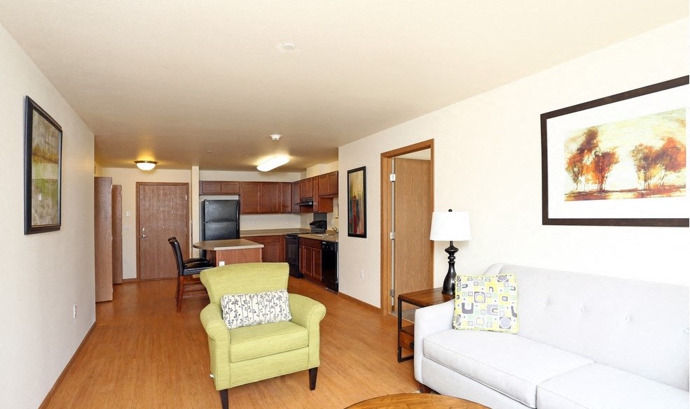 A living room with wood vinyl plank flooring