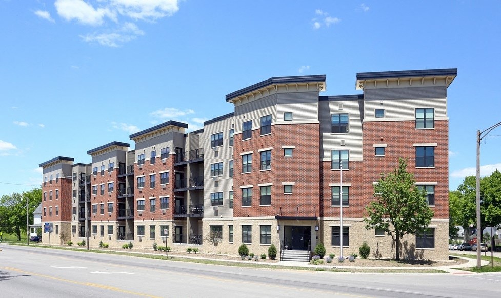 Kingston Village - modern apartment buildings with brick and stone exteriors.