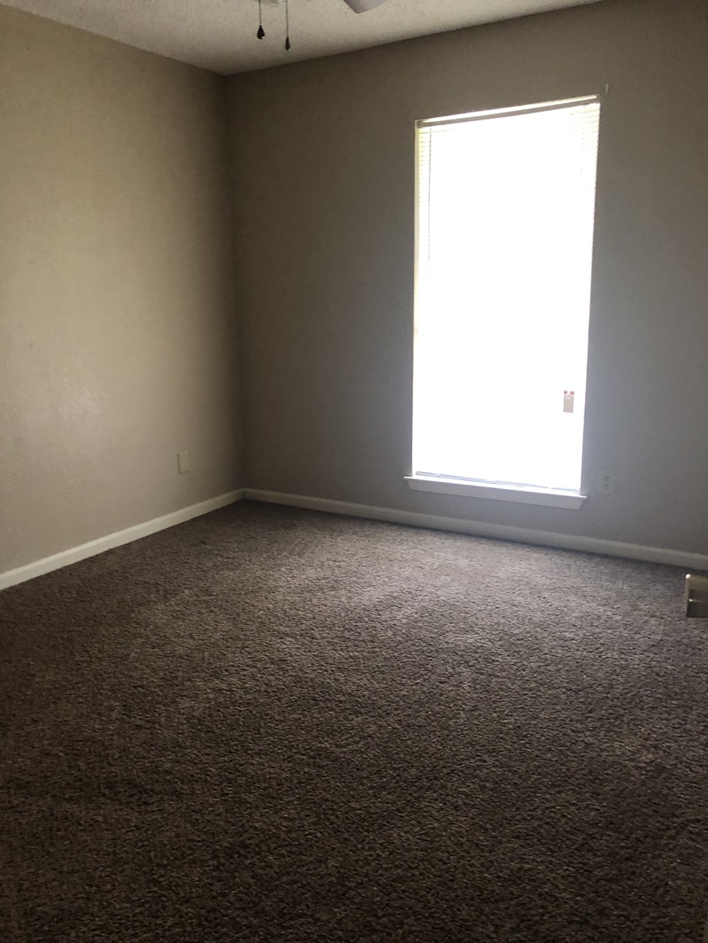 an empty room with a window in it