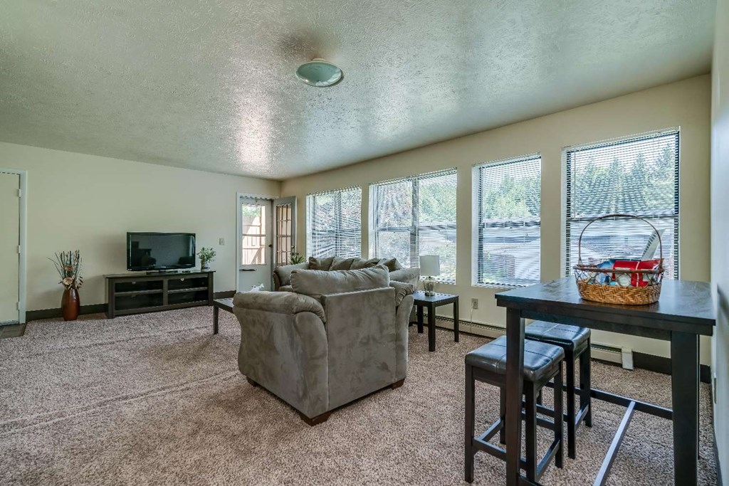 a living room with a couch and a table