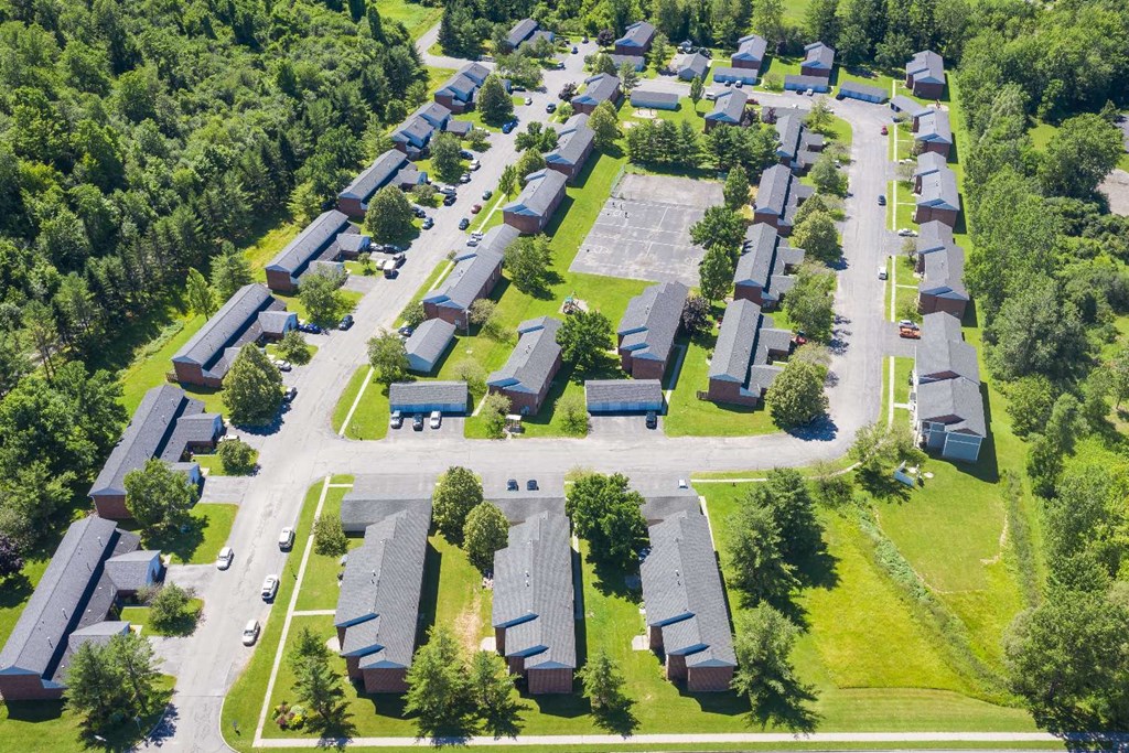 an aerial view of a neighborhood with houses and trees