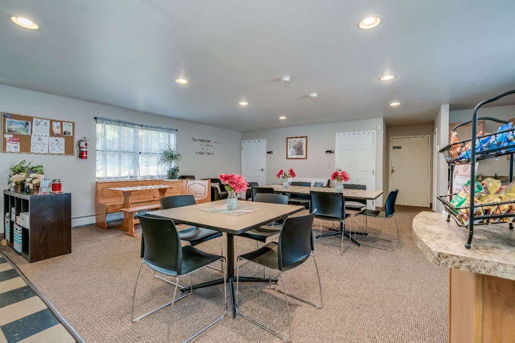 a dining room with tables and chairs
