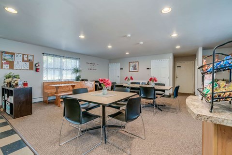 a dining room with tables and chairs