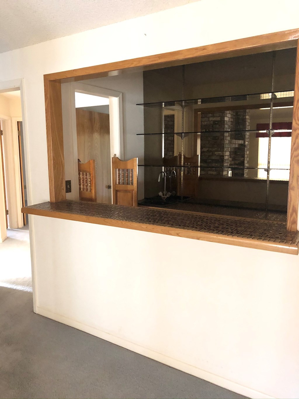 a large mirror in a room with a counter