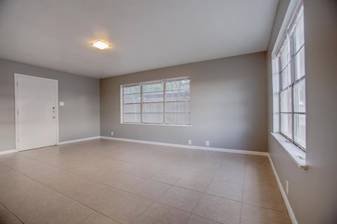 Empty room with a window and a door.