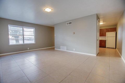 A room with a window and a door.
